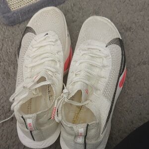 Nike White and Black Sneakers with Pink Accents